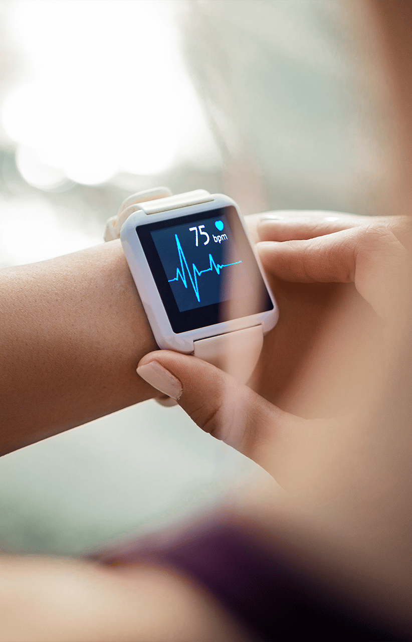 Person checking health data/biometrics on a smart watch