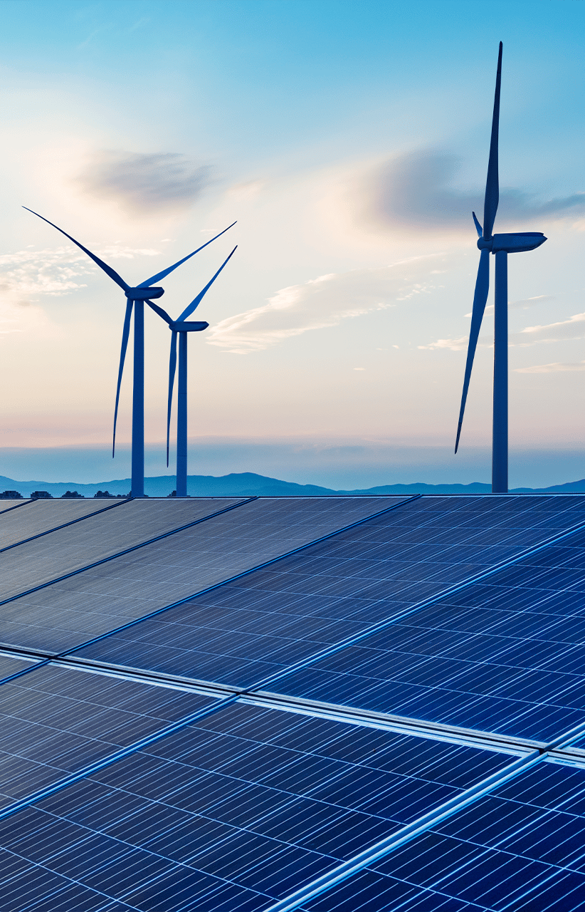 Wind turbines and solar panels at an energy farm 