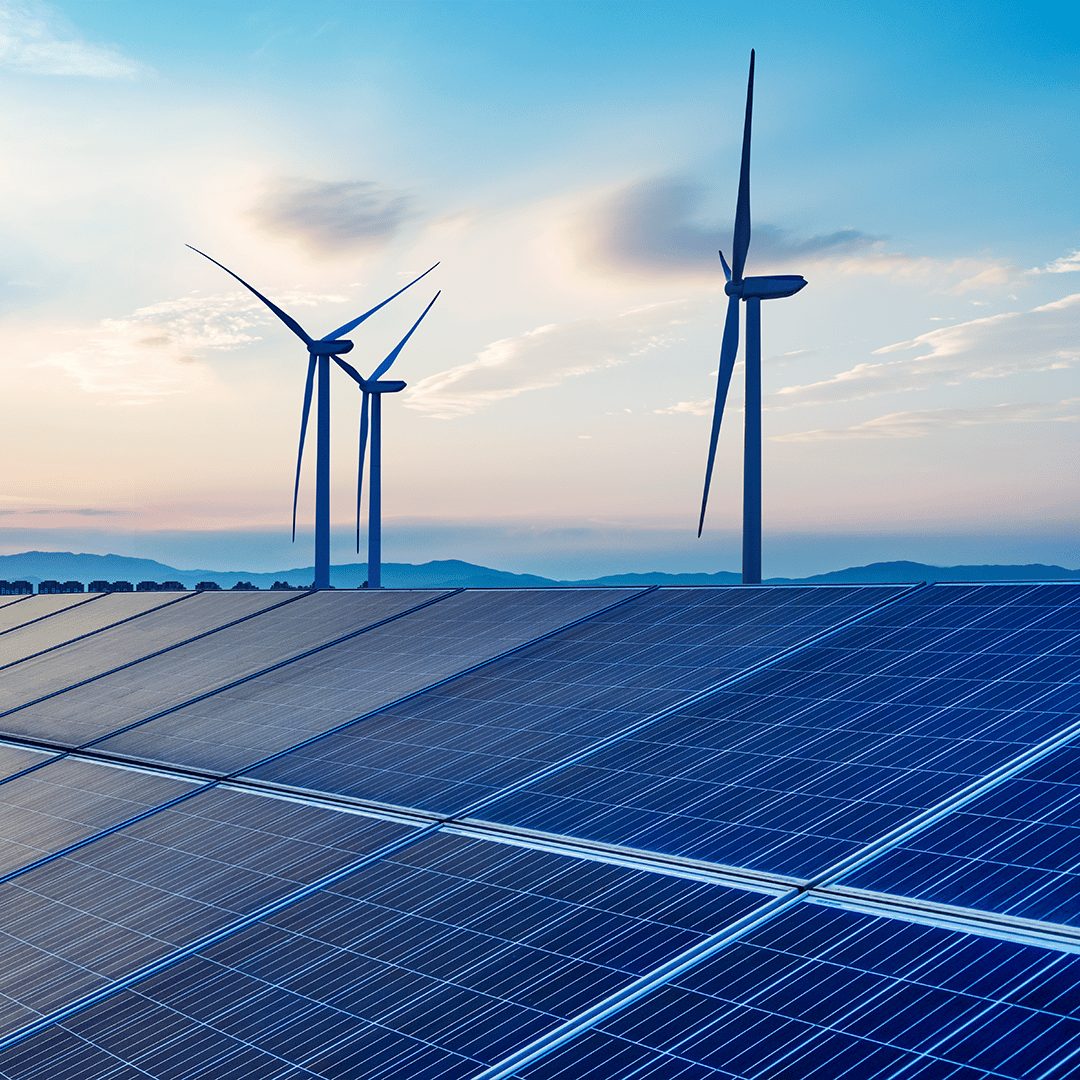 Wind turbines and solar panels at an energy farm 